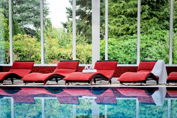 Swimming Pool and loungers at The Cloisters Spa, Parsonage Hotel